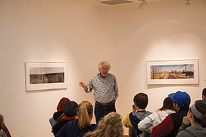 Stuart Klipper gives a talk to locals about his photography, which is currently displayed in the Furlong Gallery. 