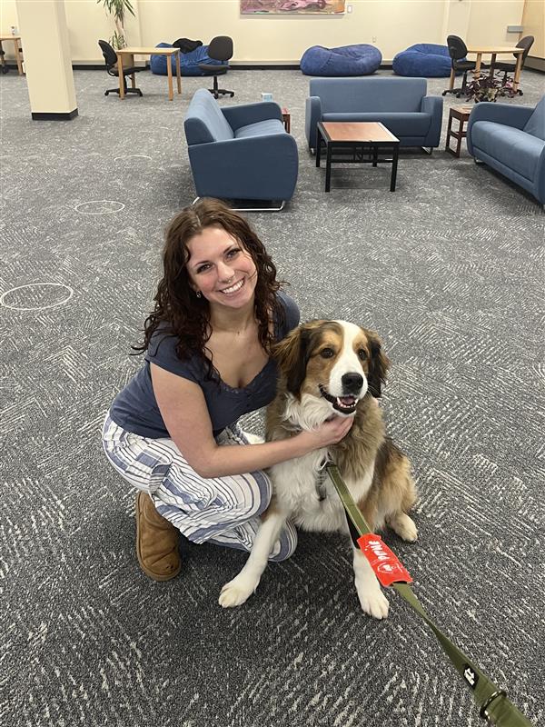 Writer Presley Hanes with a dog at Destress with Dogs!